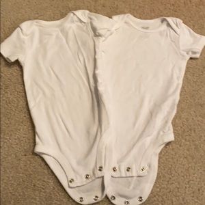 Two white onesies